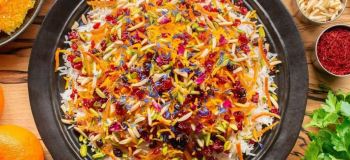 رمز و راز طرز تهیه شیرین پلو شیرازی؛ شکرپلوی اصیل با عطر زعفران و خلال نارنگی