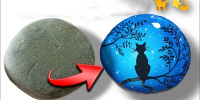 نقاشی گربه روی سنگ